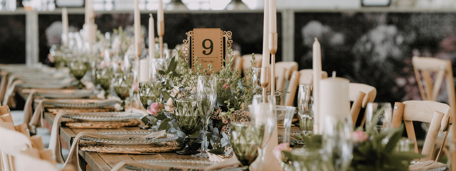 Candlelit reception tables under a tent