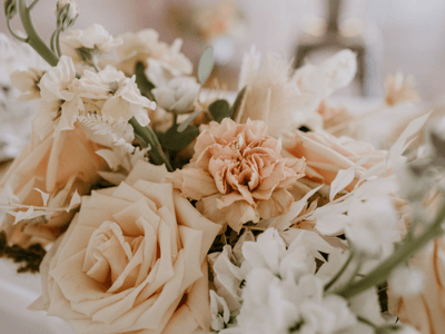 Peach and ivory garden roses in a wedding arrangement