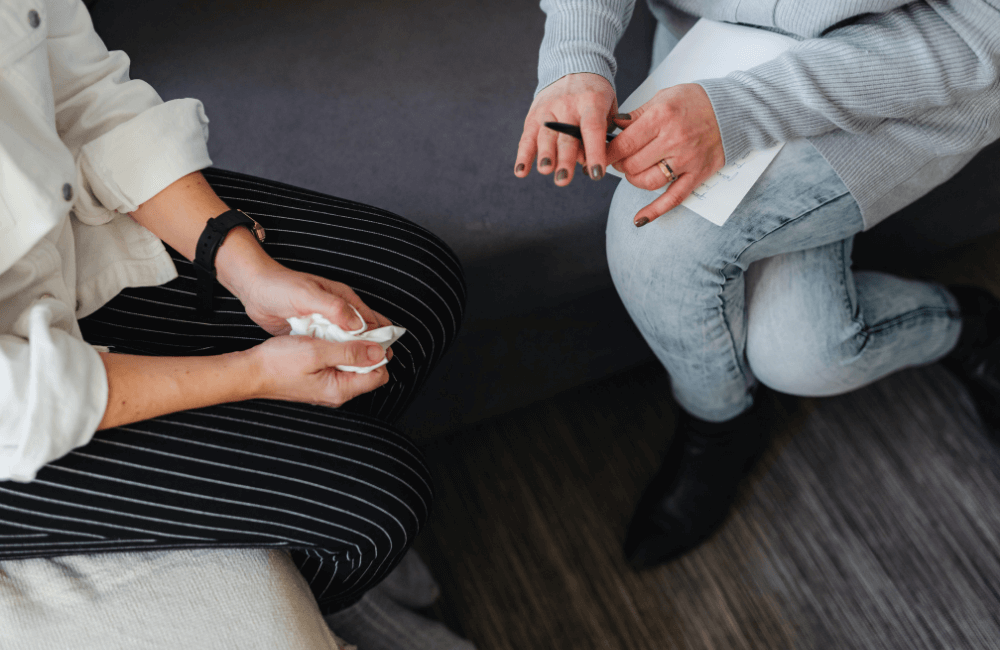Therapist and client sitting across from each other during a session