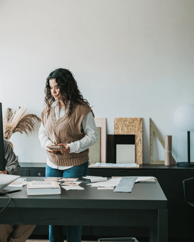 Lead designer sorting samples at a studio work table