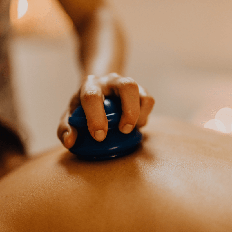 Massage oil and warm towels set out for a deep tissue session