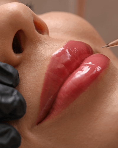 Lip blushing being applied to a client