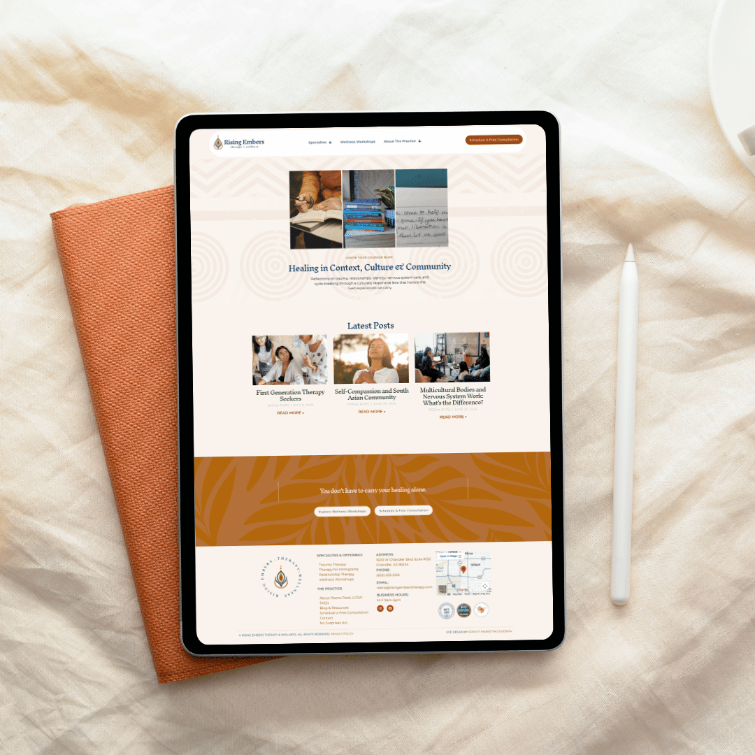 Rising Embers Therapy website displayed on a tablet