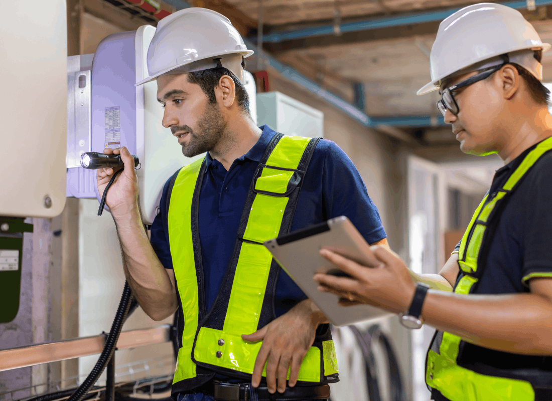 Electrician running diagnostics on an electrical panel