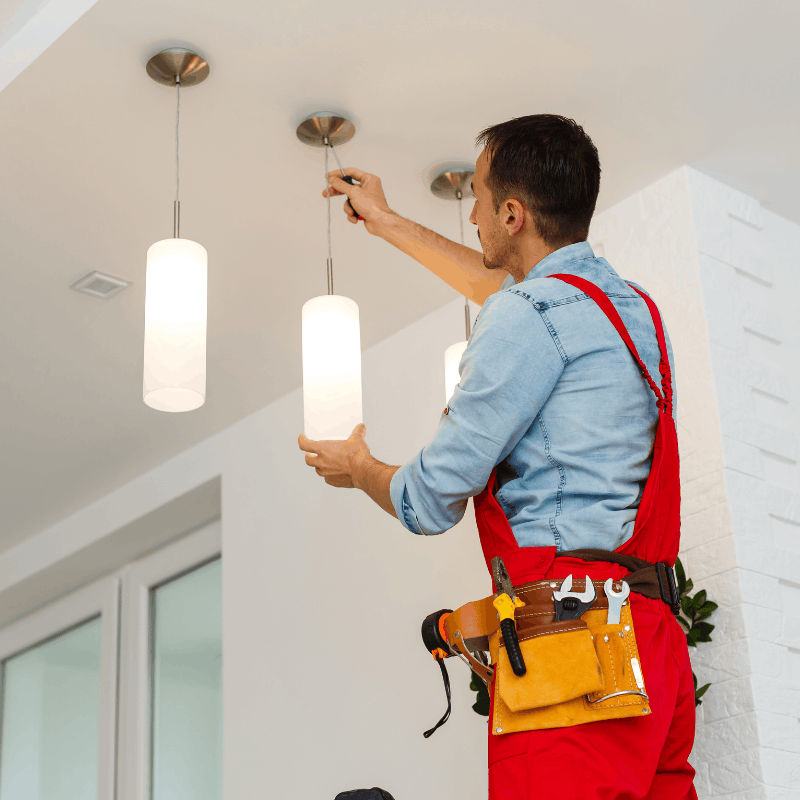 Electrician wiring a new light fixture