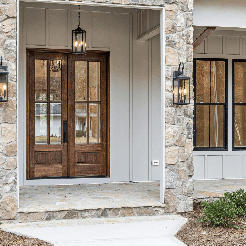 Handyman repairing exterior trim on a Boise home