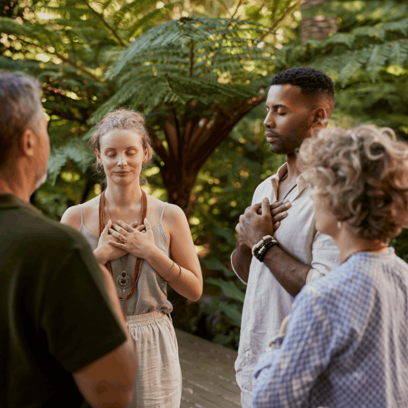 Small group seated together in a healing circle