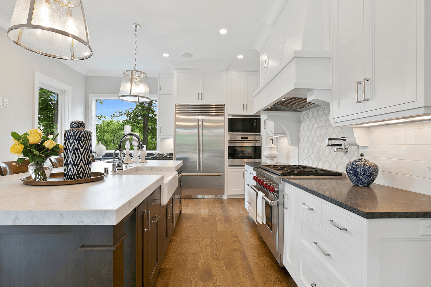 Kitchen with a large island in a Holloway custom home