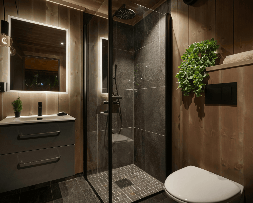 New shower faucet and trim installed in a tiled shower