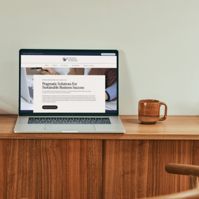 Laptop on a desk displaying Wilson Strategic Planning website homepage – Chandler web design by Sprout Marketing and Design in Chandler, AZ, offering web design and website maintenance services