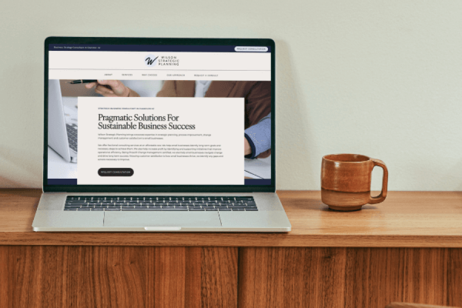 Laptop on a desk displaying Wilson Strategic Planning website homepage – Chandler web design by Sprout Marketing and Design in Chandler, AZ, offering web design and website maintenance services