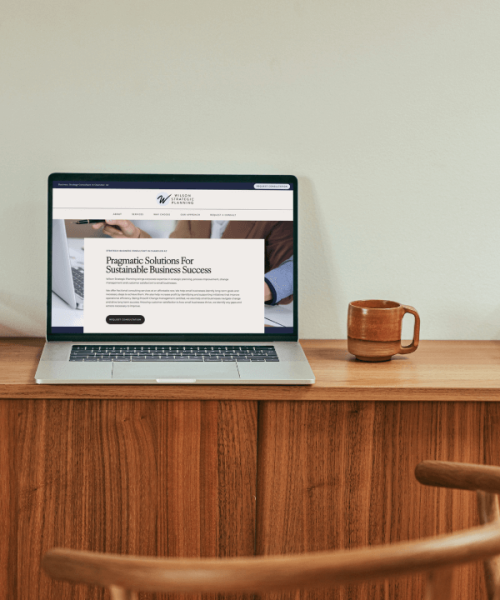 Laptop on a desk displaying Wilson Strategic Planning website homepage – Chandler web design by Sprout Marketing and Design in Chandler, AZ, offering web design and website maintenance services