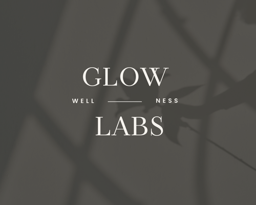Logo design concept for Glow Labs Wellness, a skincare service, with a moody silhouette of a plant in the background, created by Sprout Marketing and Design in Chandler, AZ, representing a soothing and natural brand identity