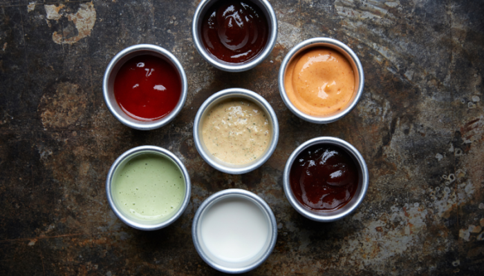 Various sauces symbolizing a strong call to action (CTA's) as the 'secret sauce' for increased customer engagement, from Sprout Marketing and Design’s blog